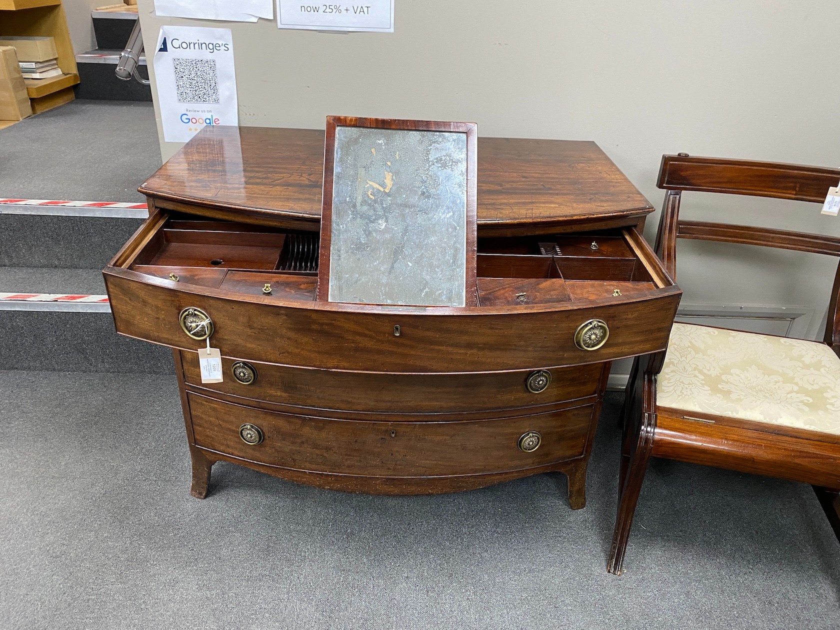 A George III mahogany bowfront dressing chest, with fitted interior, width 106cm, depth 61cm, height 85cm